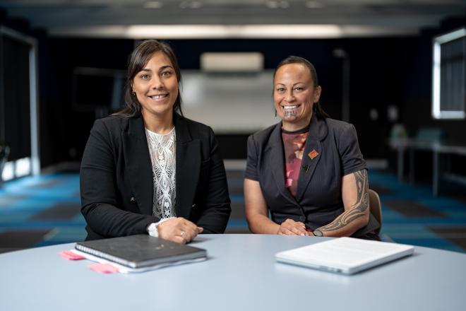 Aspiring Principal Programme participant Casey and her mentor Ngaere are sitting at a desk in a classroom.